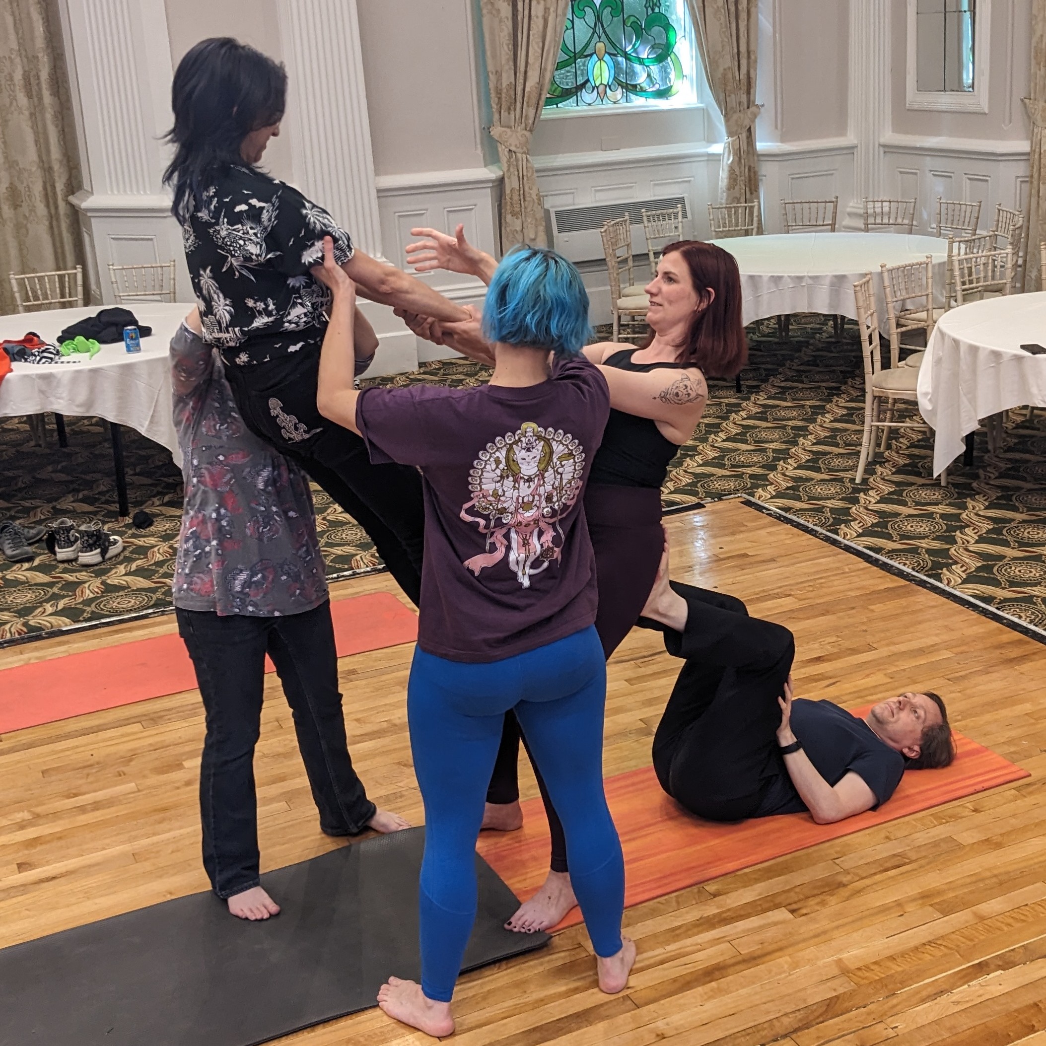 People learning acro-yoga