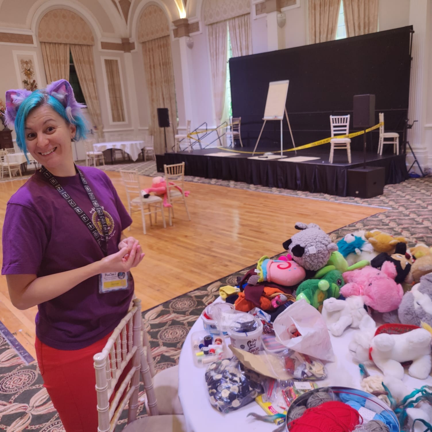 Committee member Jayme with a collection of stuffed toys