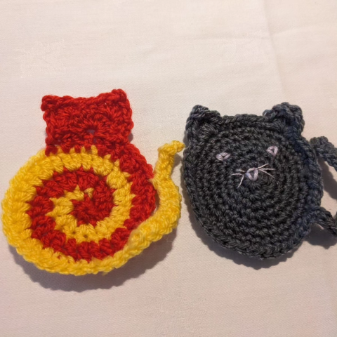 Two cat crochet coasters