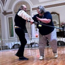 People swordfighting