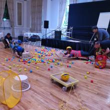 People playing live action Hungry Hippos